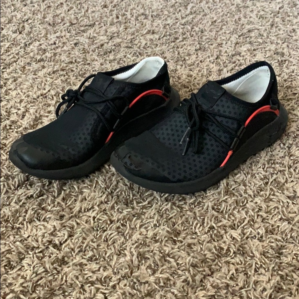 Under Armor kids shoe minor tear in the front left